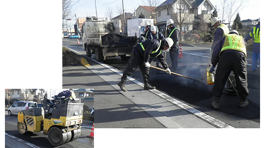 住宅地の道路での舗装補修作業